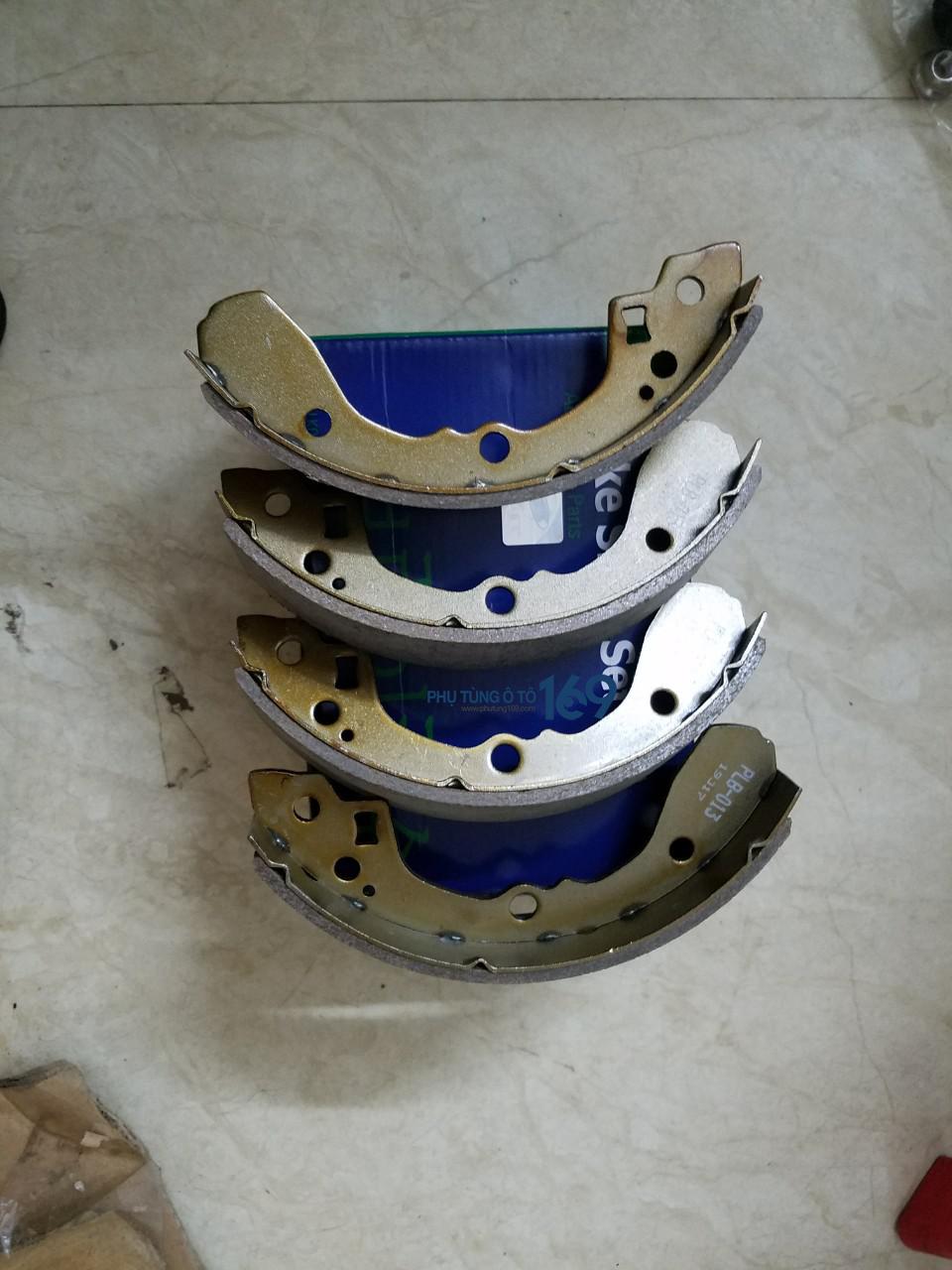 Má phanh sau Spectra Má phanh sau Spectra